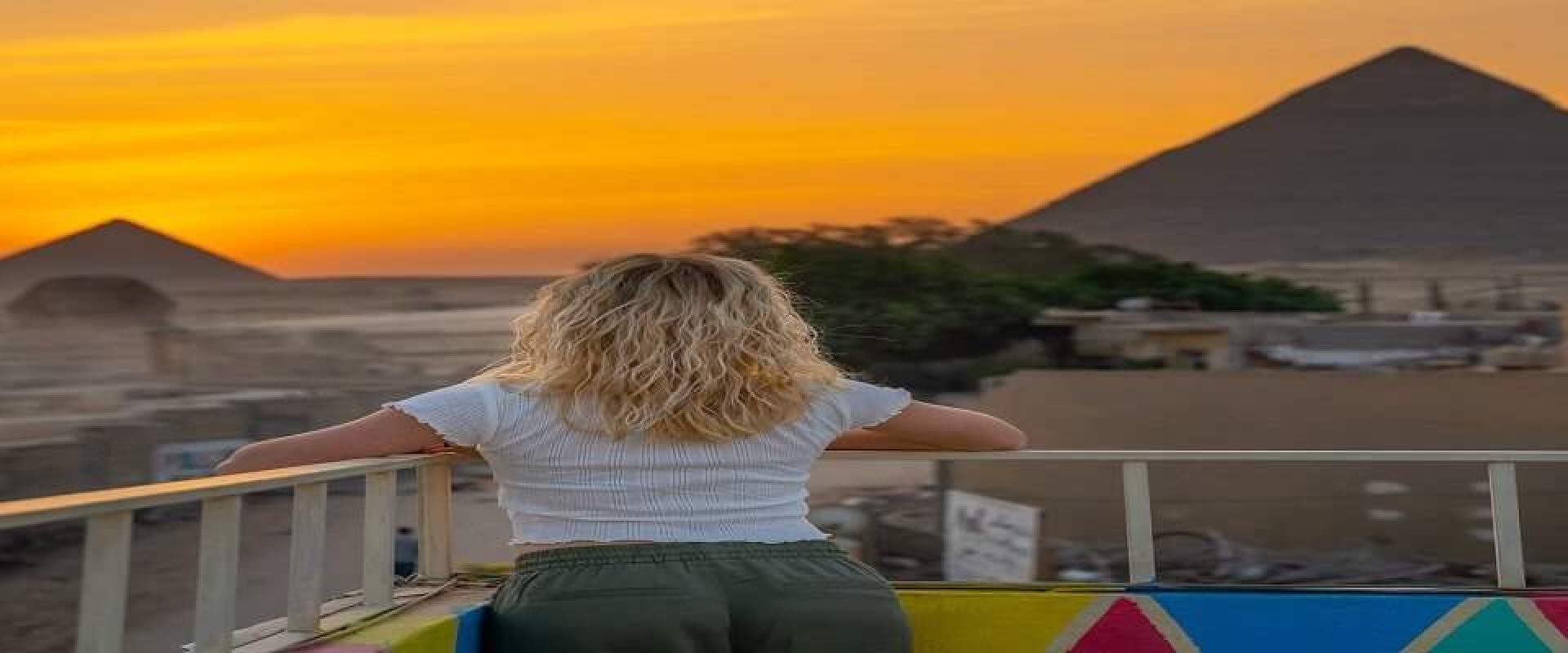 woman looking at pyramids view